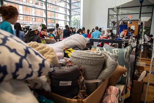 Image of donations and people shopping at the green sale